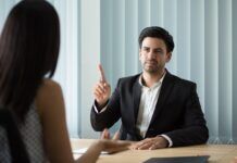 What Happens if Your Employer Forces You to Quit Your Job? an Employment Lawyer Explains Portrait of Serious Executive Explaining Tasks to Employee