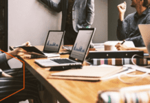 Unlock Growth with the Right Manufacturing Partner Business analytics with people in a meeting room