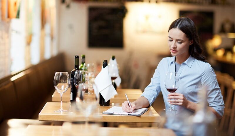 No Vines, No Problem: Crafting a Clever Wine Business from Scratch A women entreprenuer tasting vine